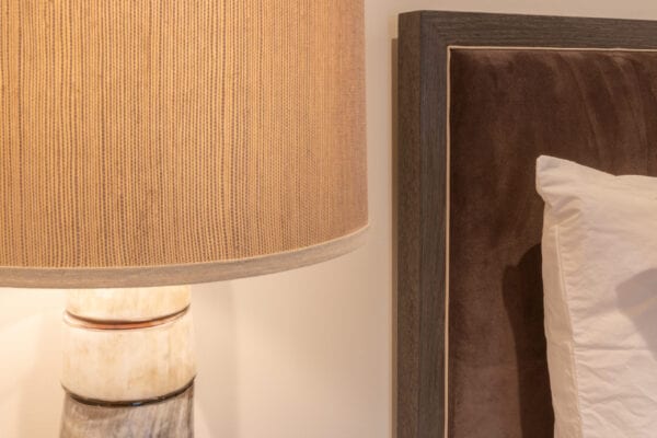 Lamp and headboard detail closeup