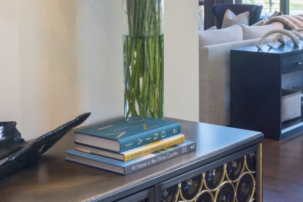 Console with flowers and books