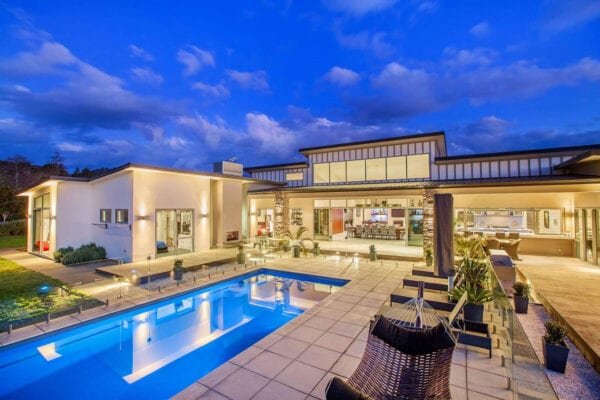 Back view of home and pool