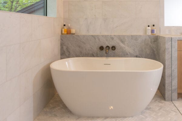 Large bathtub within shower area.